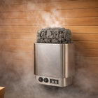 Steam rising off the rocks of a Procraft electric sauna heater